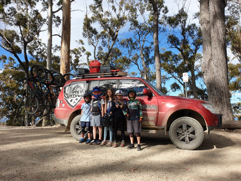 Group of students bikers during shuttles and coaching lessons - MTB Tasmania