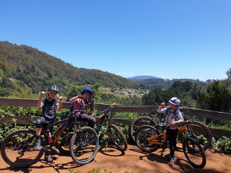 young riders enjoying the view of Derby Tasmania - MTB Tasmania